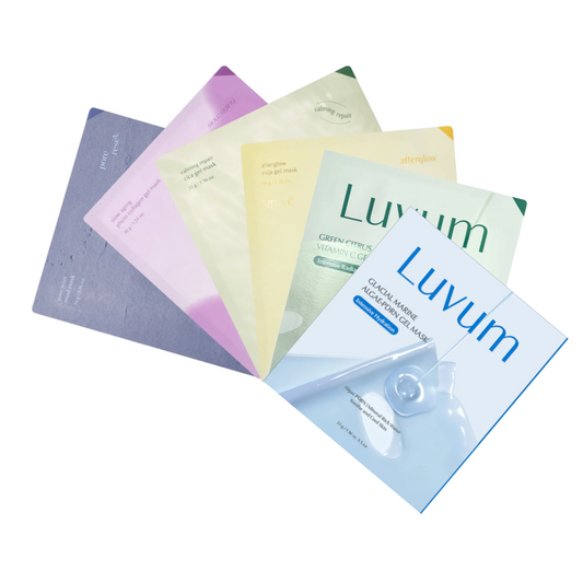 Bilde av fem ansiktsmasker fra Luvum